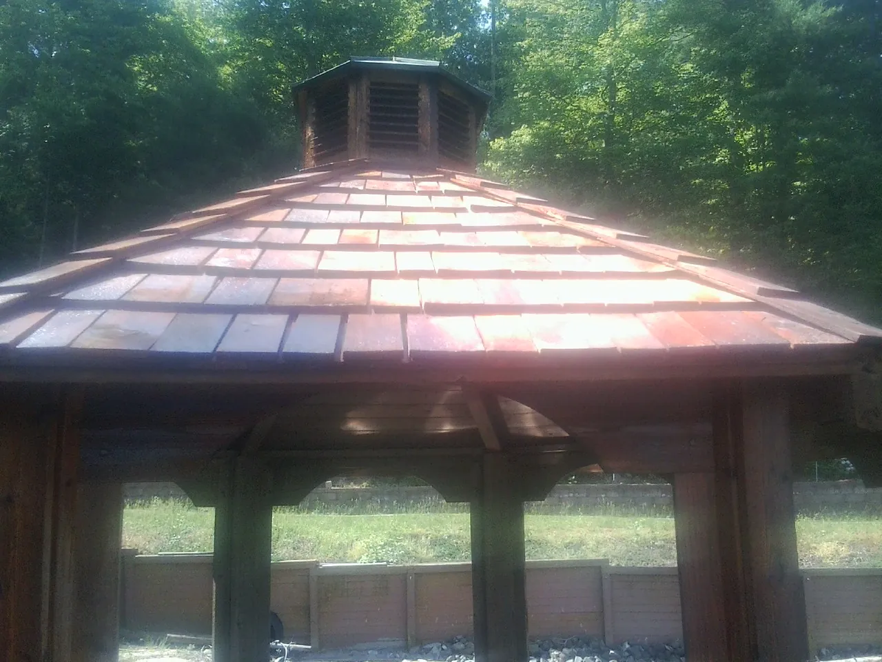 New cedar shake roof and cupola on a lakeside gazebo in Hillsboro